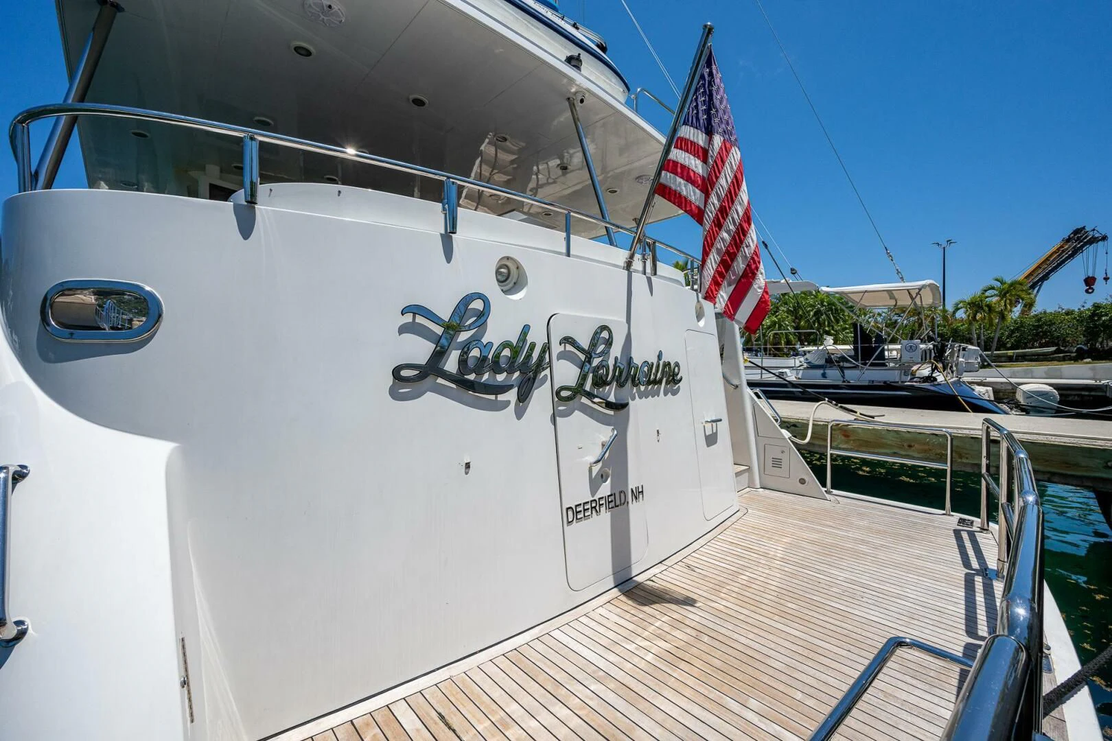 a boat with a flag on the front aboard LADY LORRAINE Yacht for Sale