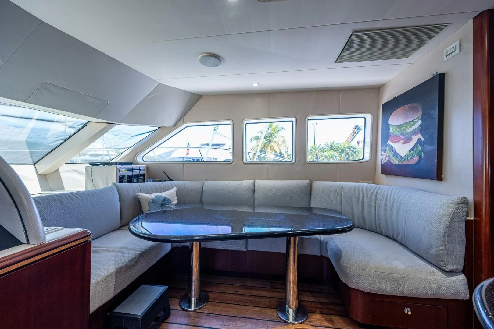 a living room with a couch and a table aboard LADY LORRAINE Yacht for Sale
