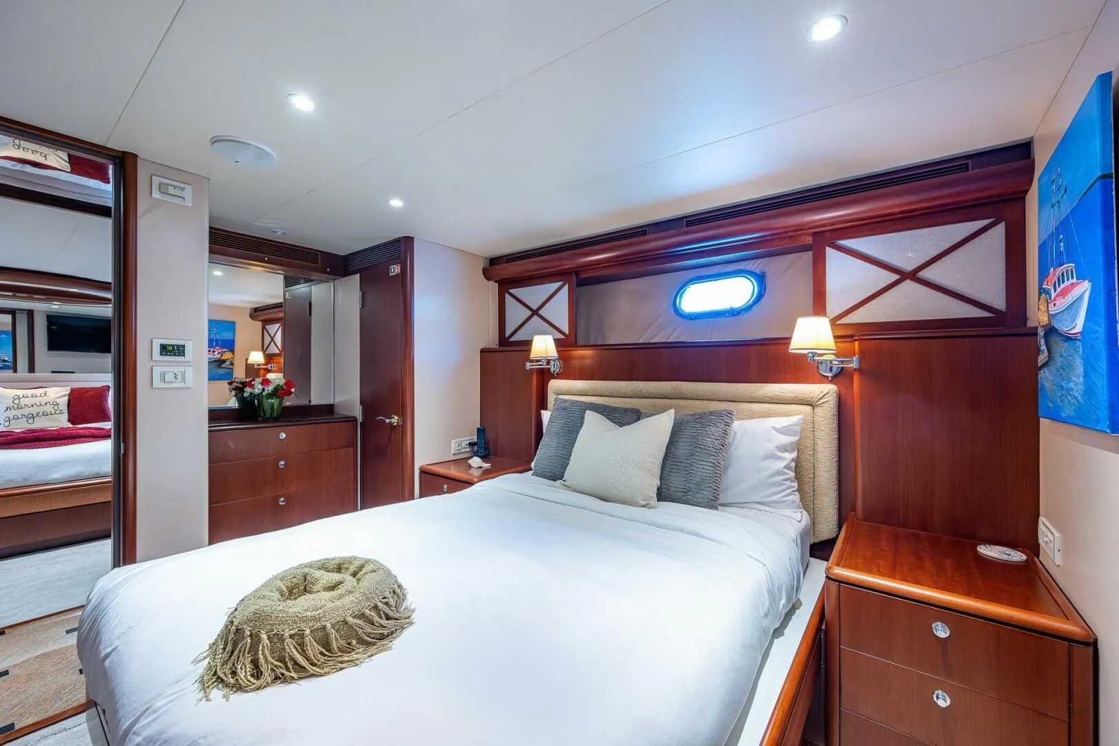 a bedroom with a bed and a desk aboard LADY LORRAINE Yacht for Sale
