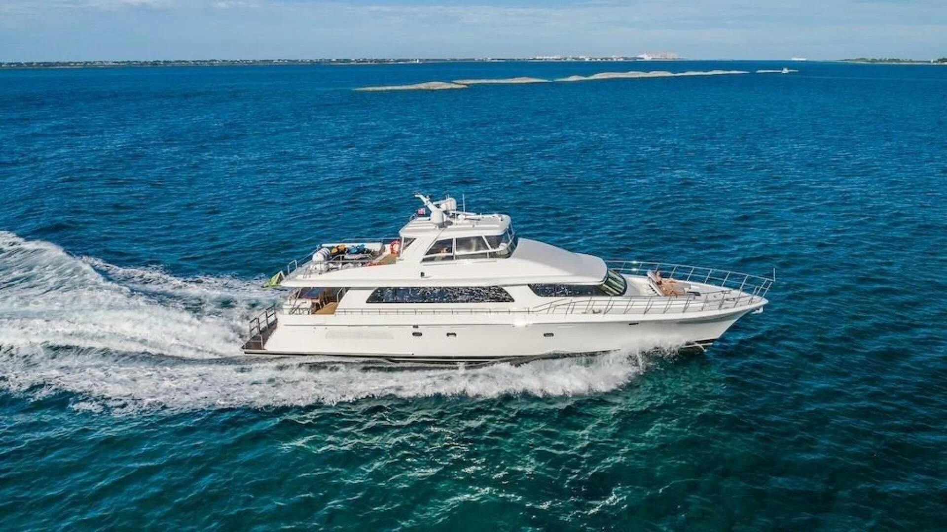 a white boat on the water aboard LADY LORRAINE Yacht for Sale