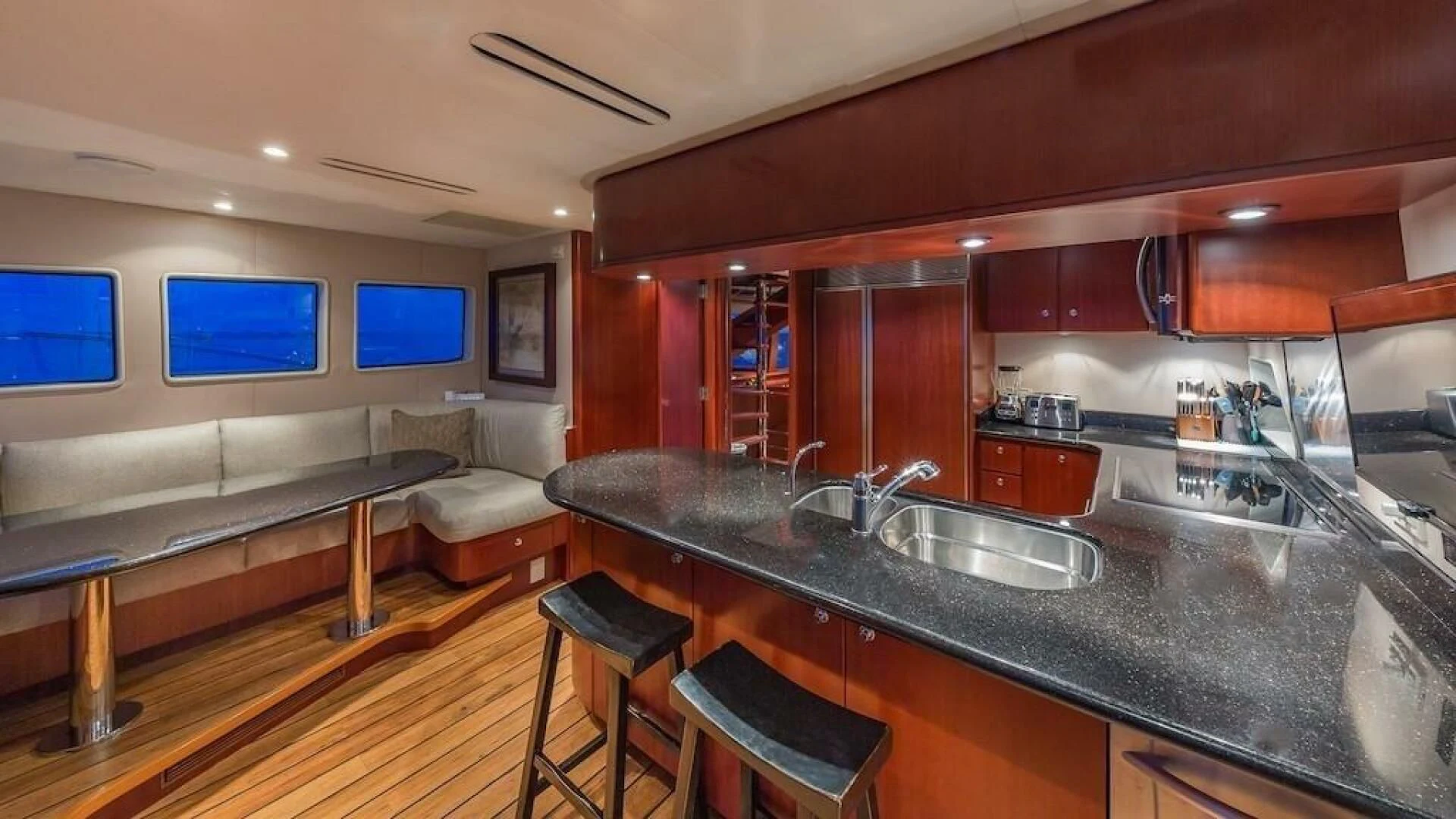 a kitchen with a large island aboard LADY LORRAINE Yacht for Sale