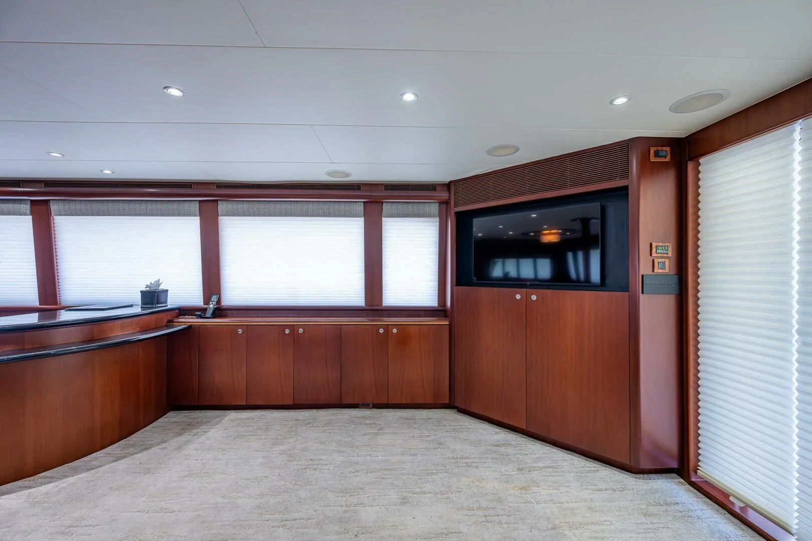 a room with a tv and a window aboard LADY LORRAINE Yacht for Sale