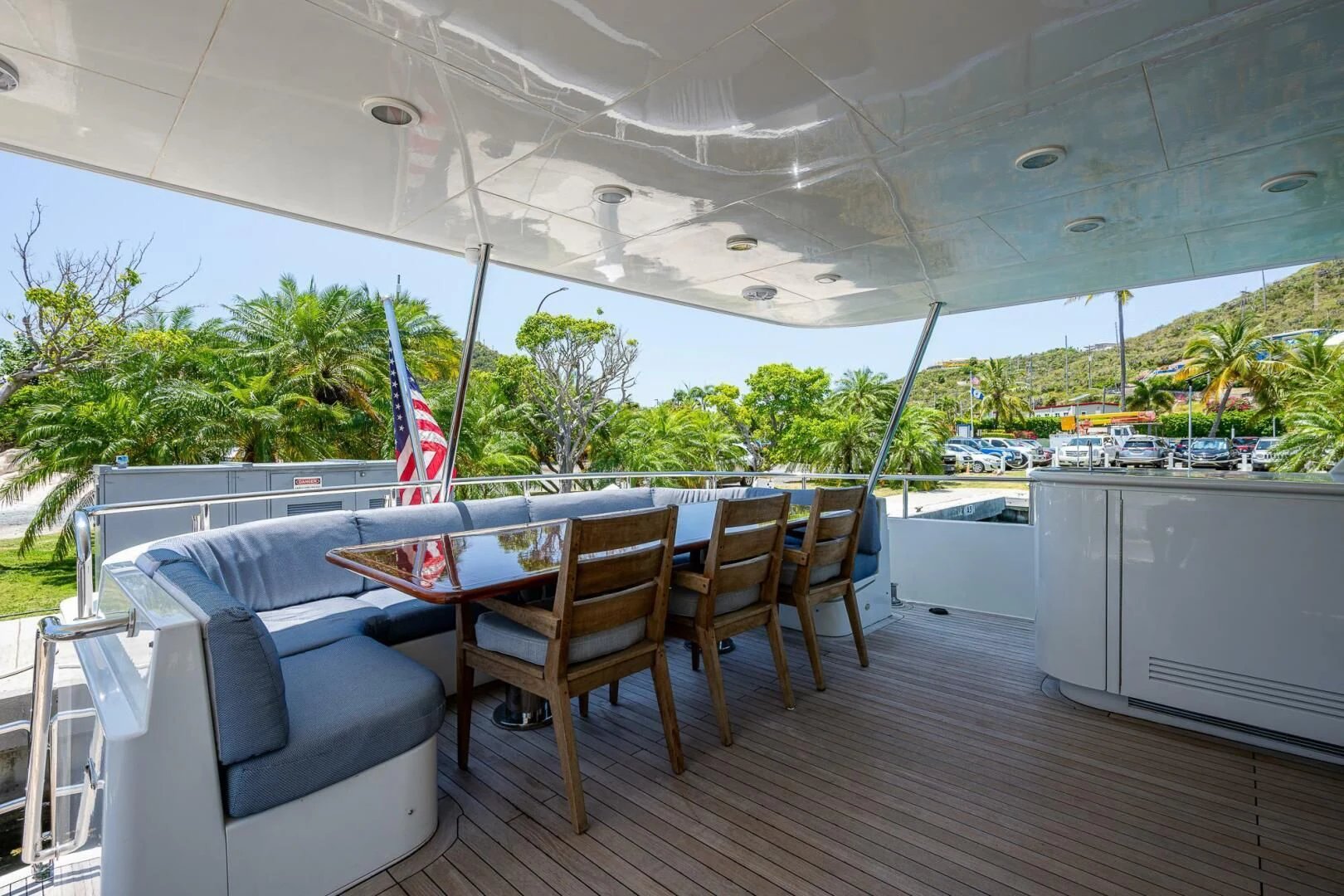 a deck with a table and chairs aboard LADY LORRAINE Yacht for Sale