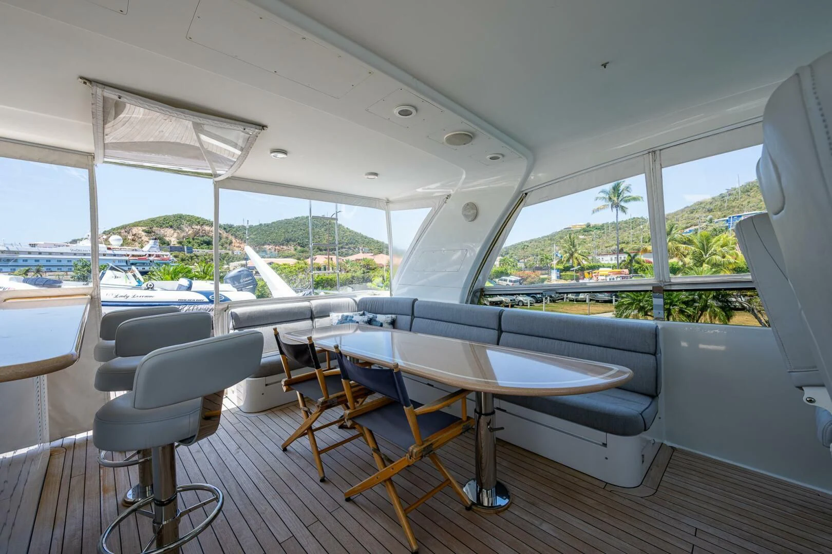 a boat with a table and chairs aboard LADY LORRAINE Yacht for Sale