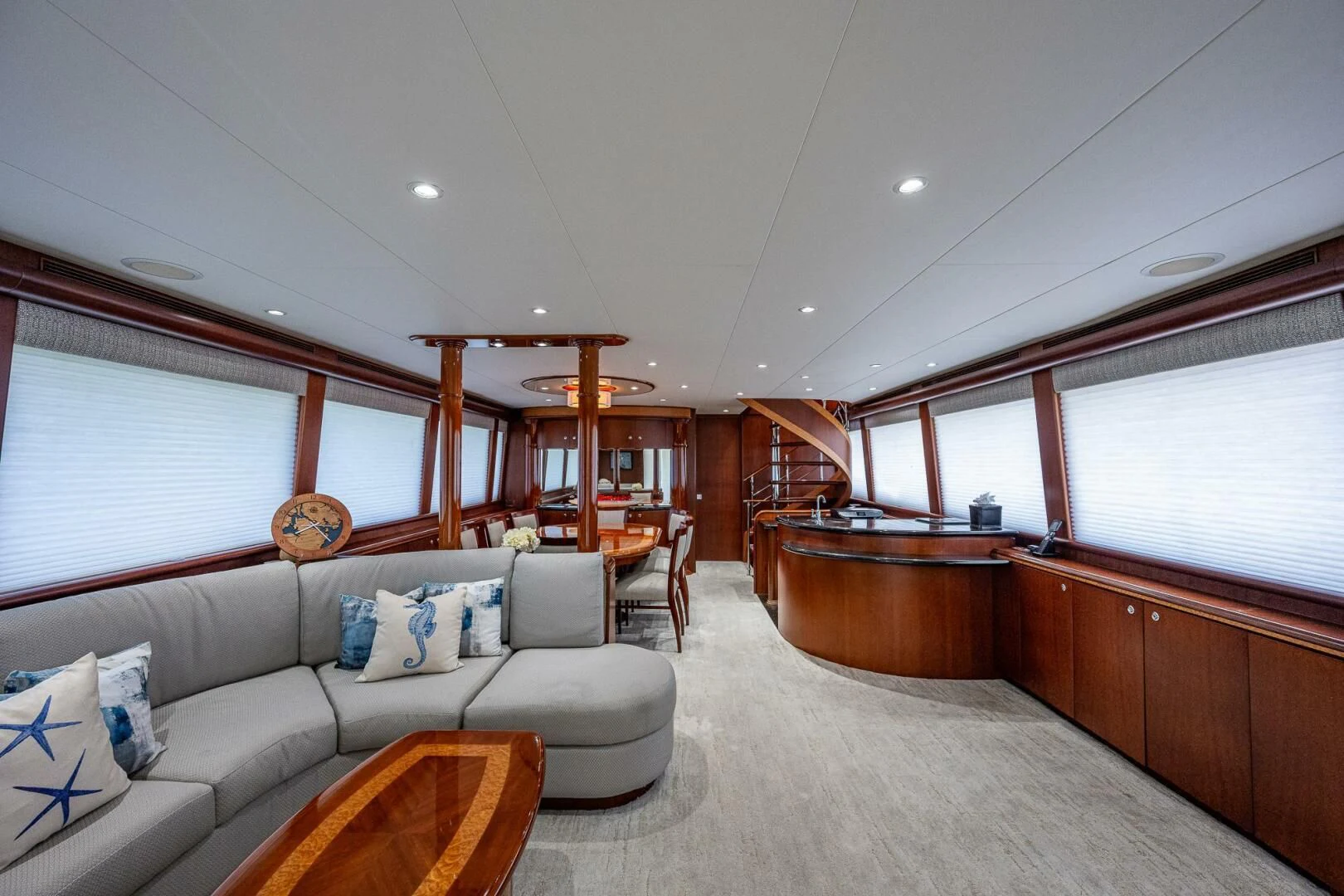a living room with a couch and a table aboard LADY LORRAINE Yacht for Sale