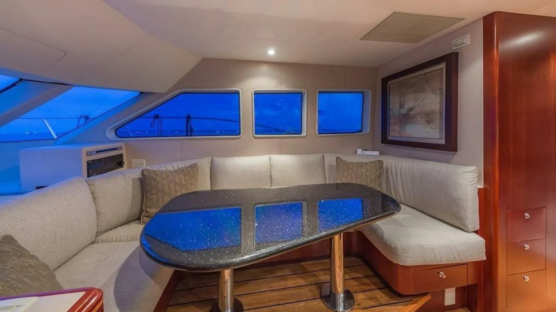 a living room with a couch and a table aboard LADY LORRAINE Yacht for Sale
