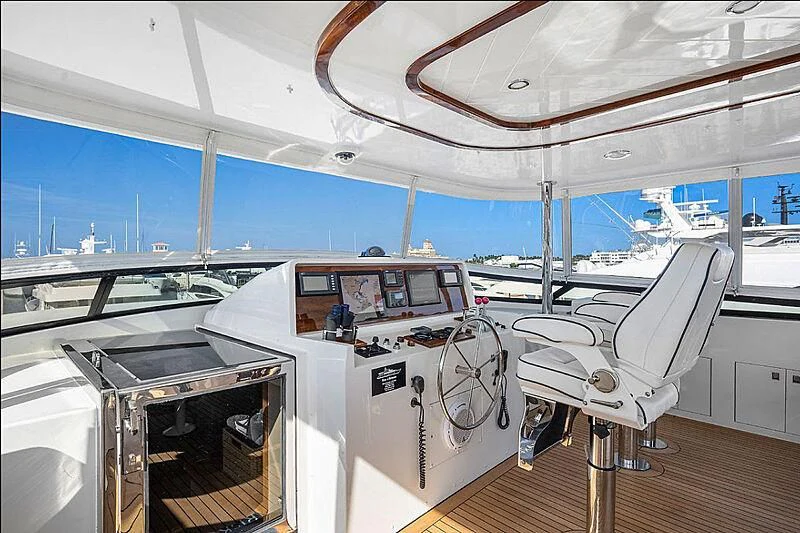 a white chair in a room aboard SUPERSTAR Yacht for Charter