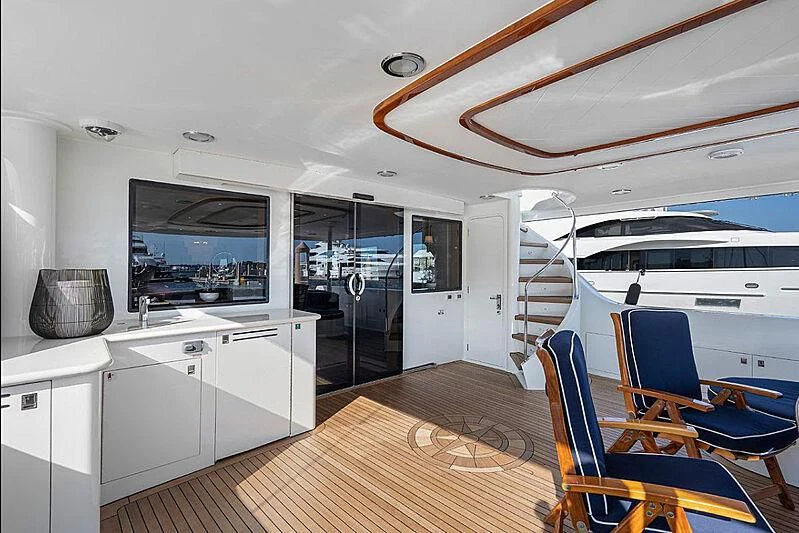 a kitchen with a wood floor aboard SUPERSTAR Yacht for Charter