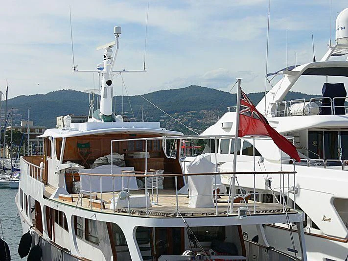 a boat with a flag on the front aboard ALMORIA Yacht for Sale