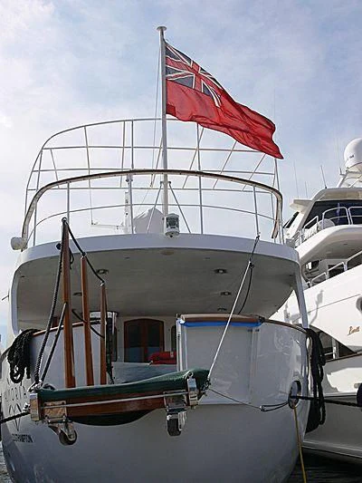 a boat with a flag on the front aboard ALMORIA Yacht for Sale