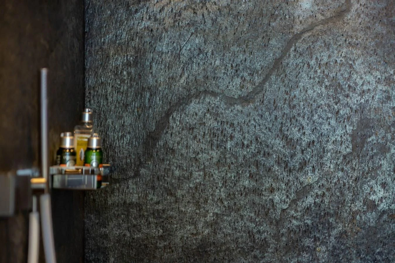 a concrete wall with bottles on it aboard X-TREM II Yacht for Sale