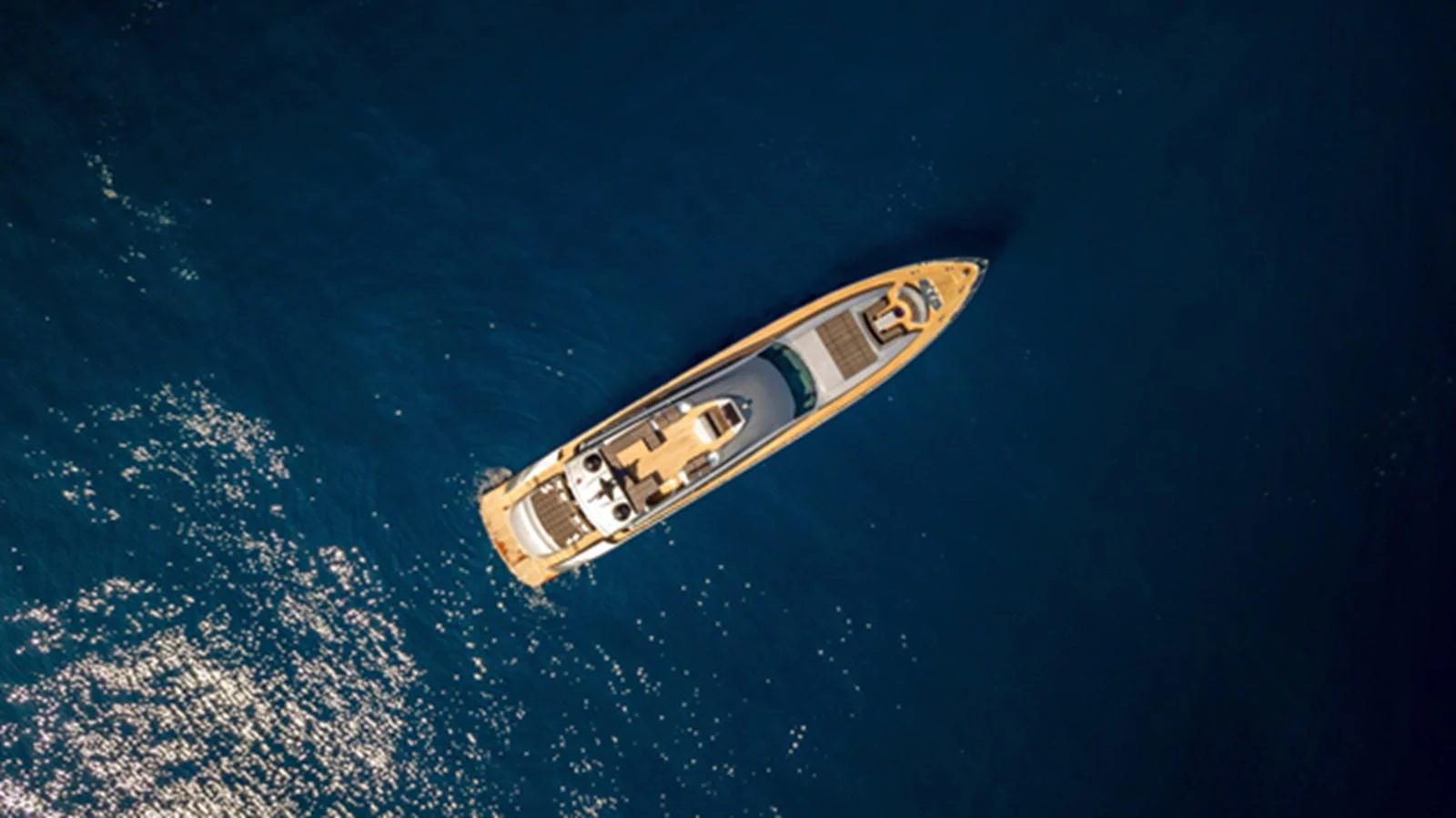 a bottle of alcohol floating in space aboard X-TREM II Yacht for Sale