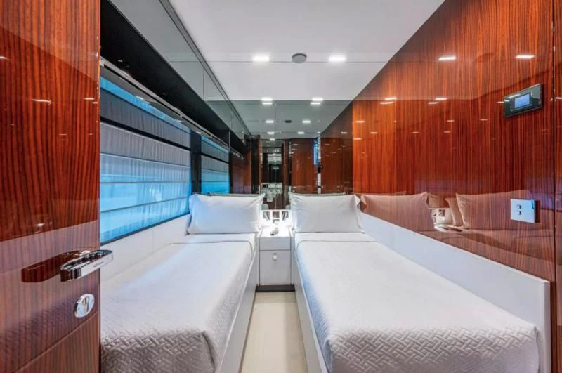 a room with beds and a window aboard RIVA FOLGORE 88/14 Yacht for Sale
