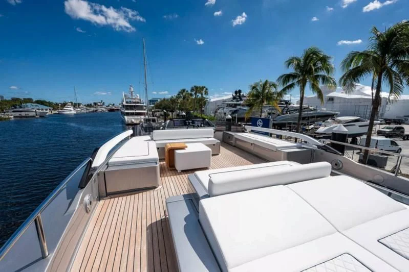 a deck with a pool and boats on it aboard RIVA FOLGORE 88/14 Yacht for Sale