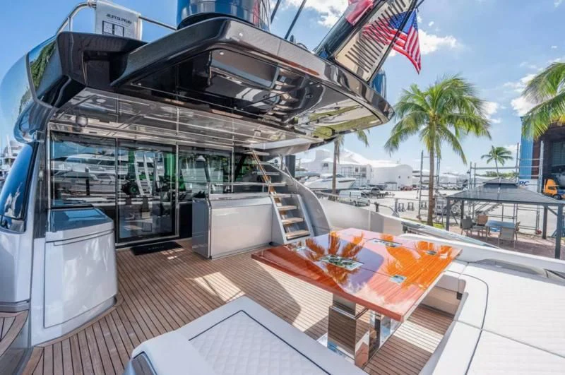 a large white truck with a flag on the front aboard RIVA FOLGORE 88/14 Yacht for Sale