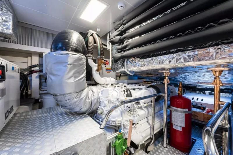 a person in a white coat in a factory aboard RIVA FOLGORE 88/14 Yacht for Sale