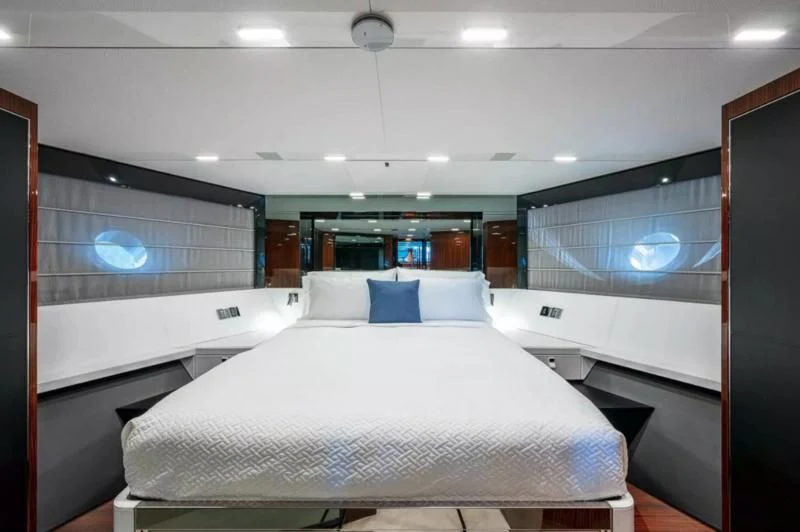 a room with a bed and a window aboard RIVA FOLGORE 88/14 Yacht for Sale