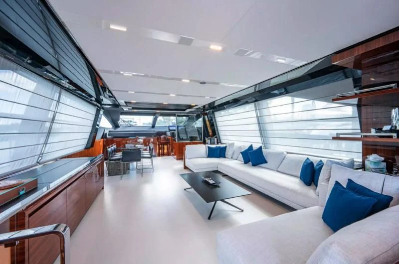 a room with couches and a table aboard RIVA FOLGORE 88/14 Yacht for Sale