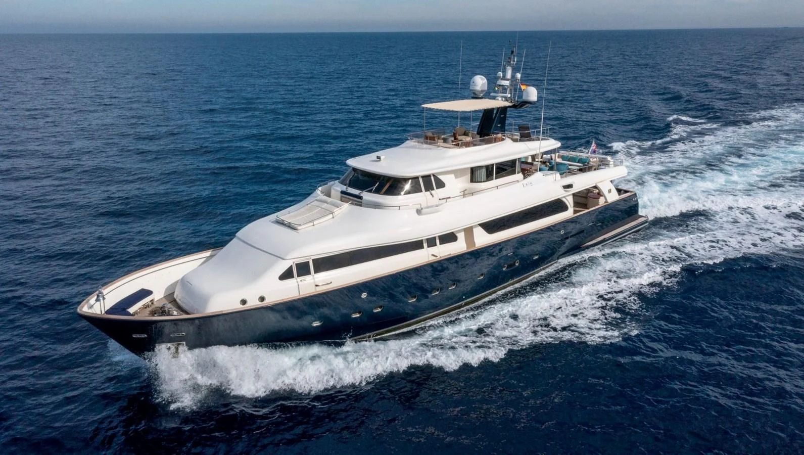 a white boat on the water aboard BIM Yacht for Sale
