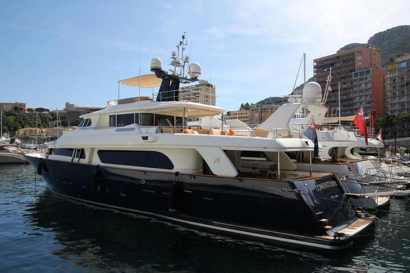 a boat docked at a pier aboard BIM Yacht for Sale