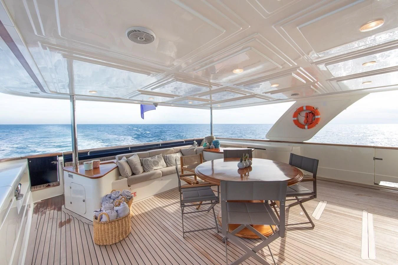 a boat with a table and chairs aboard BIM Yacht for Sale