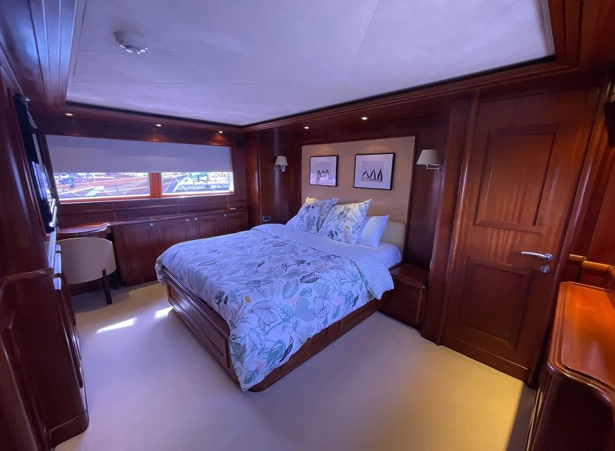 a bed in a room aboard BIM Yacht for Sale