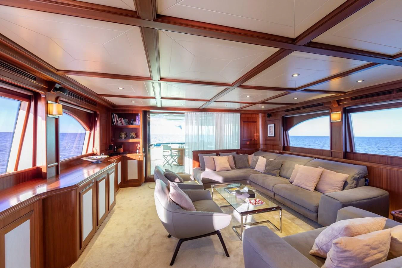 a living room with a couch and a coffee table aboard BIM Yacht for Sale