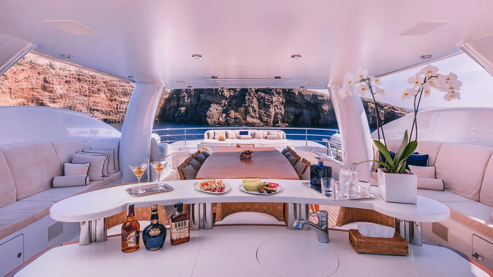 a room with a table and chairs aboard ARIELA Yacht for Sale