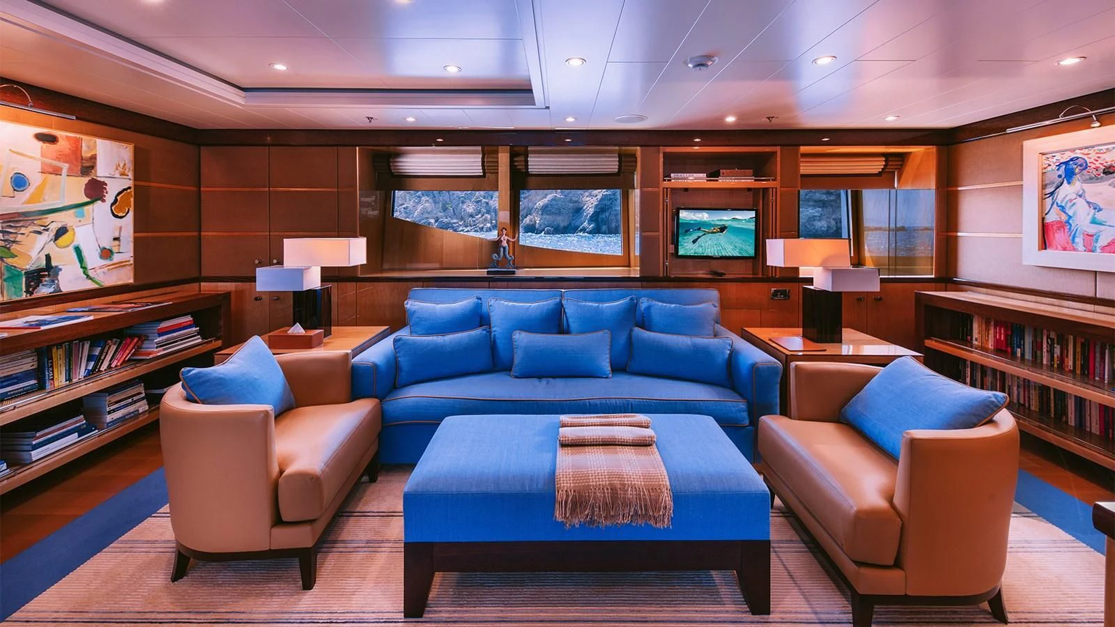 a room with a couch and a table aboard ARIELA Yacht for Sale