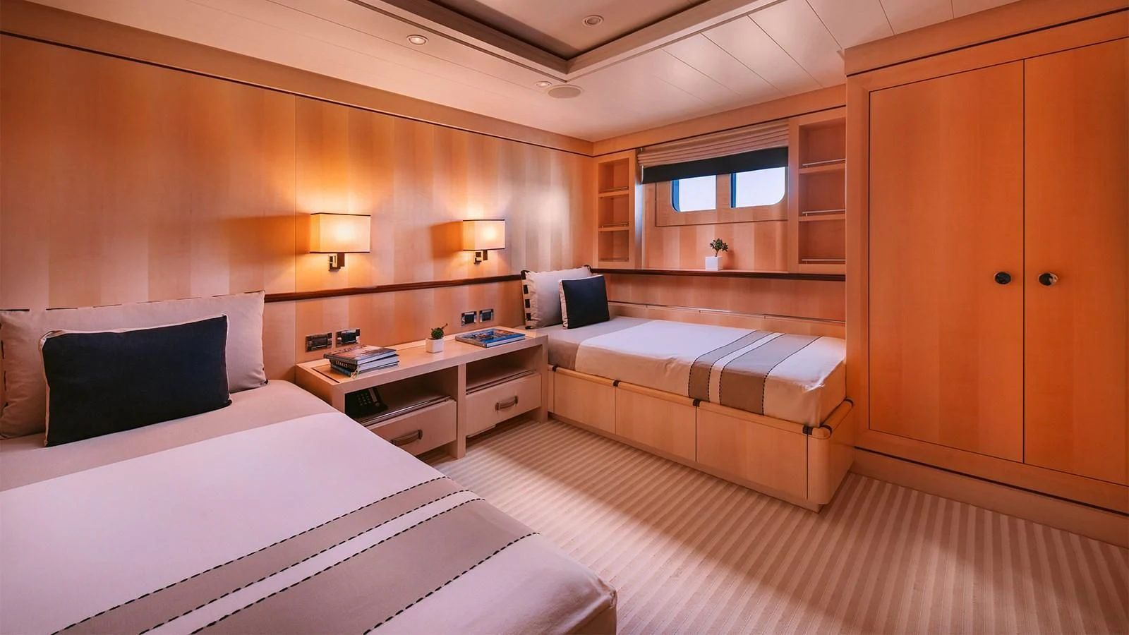 a room with a bed and a desk aboard ARIELA Yacht for Sale