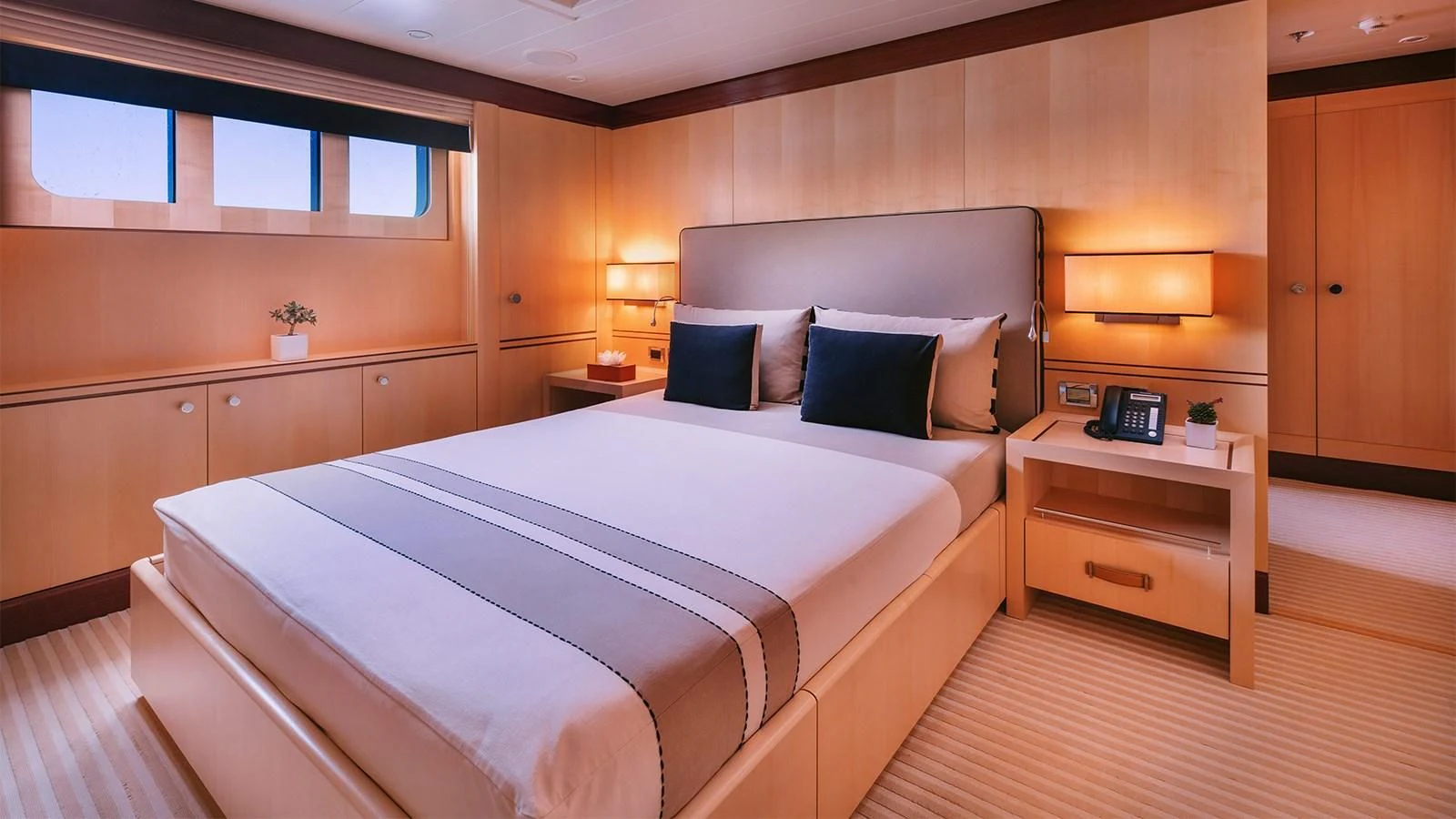 a bed in a room aboard ARIELA Yacht for Sale
