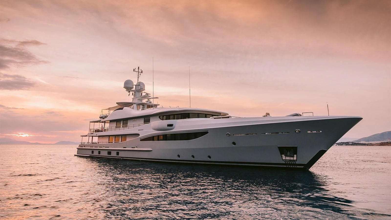 a white yacht in the water aboard ARIELA Yacht for Sale