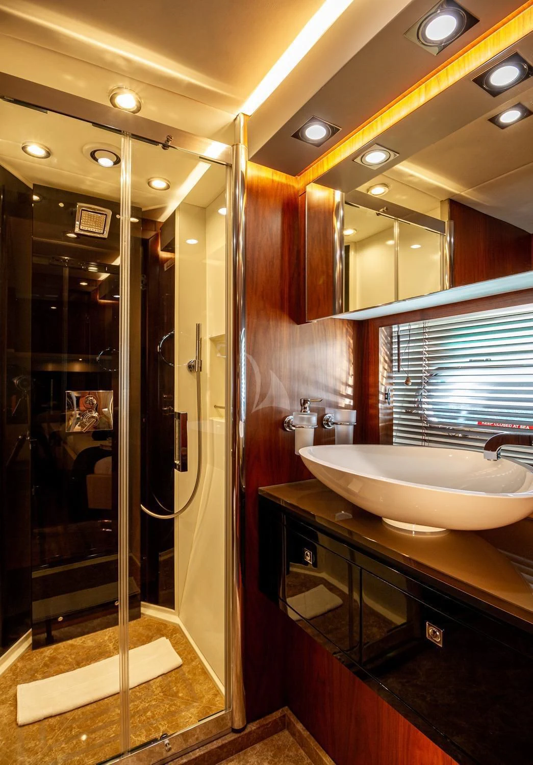a bathroom with a glass shower aboard BASAD Yacht for Sale
