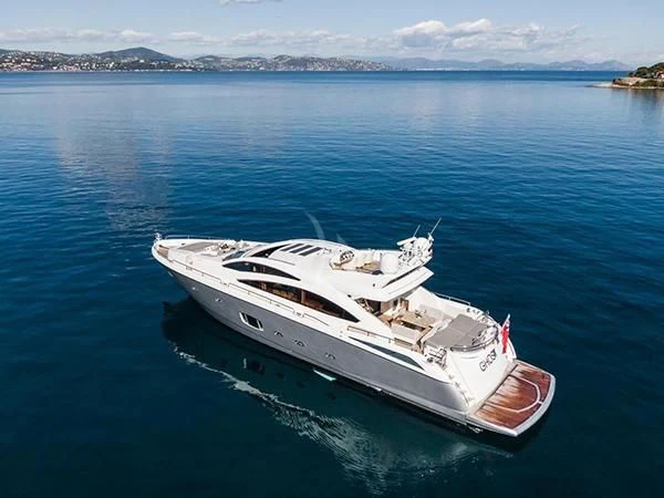 a white boat in the water aboard BASAD Yacht for Sale