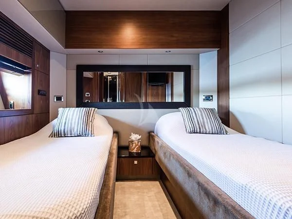 a bedroom with two beds aboard BASAD Yacht for Sale