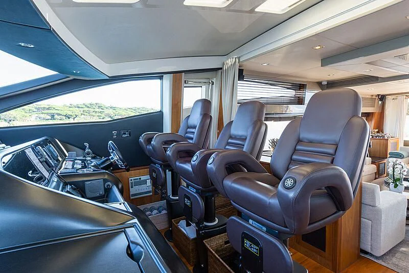 inside of a car with a desk and chairs and a window aboard BASAD Yacht for Sale