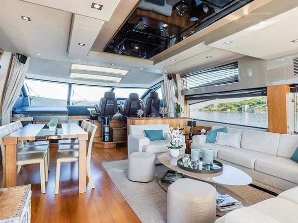 a living room with a large window aboard BASAD Yacht for Sale