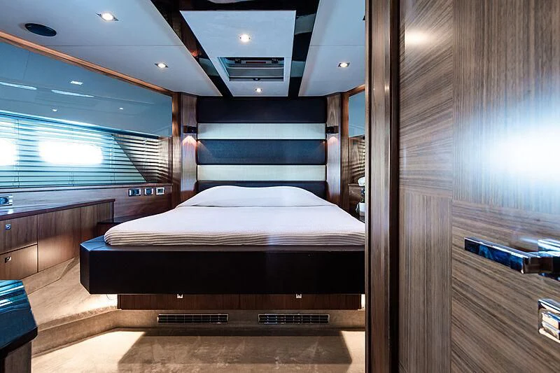 a room with a bed and a wood door aboard BASAD Yacht for Sale