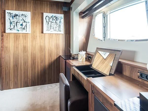 a kitchen with a table and chairs aboard BASAD Yacht for Sale