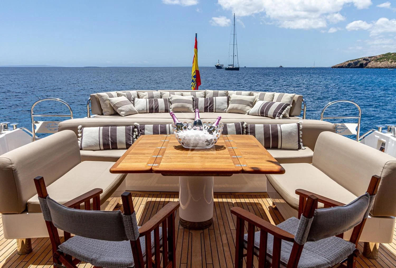 a table set for a dinner on a boat aboard BASAD Yacht for Sale