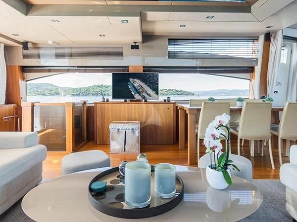 a room with a table chairs and a planter aboard BASAD Yacht for Sale