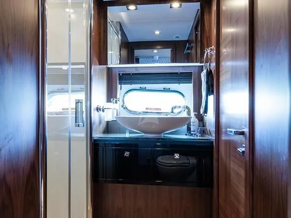 a bathroom with a sink and a mirror aboard BASAD Yacht for Sale