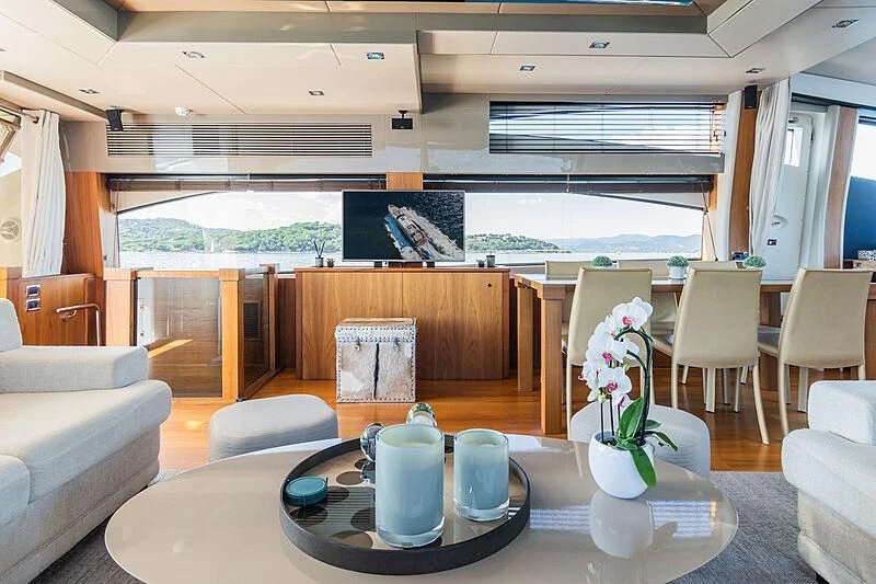 a living room with a table and chairs aboard BASAD Yacht for Sale