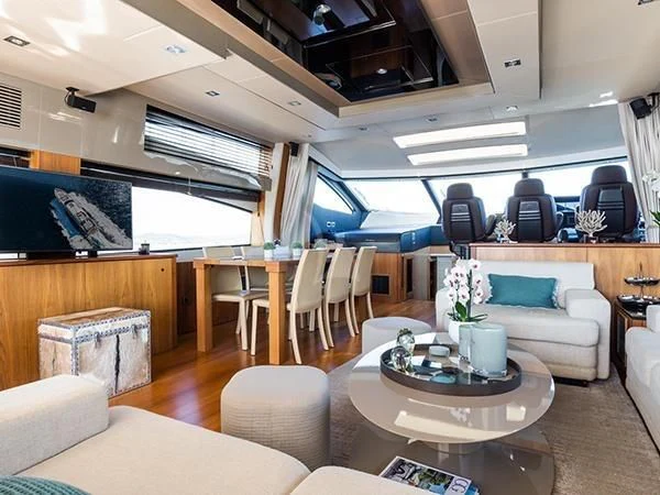 a living room with a table and chairs aboard BASAD Yacht for Sale