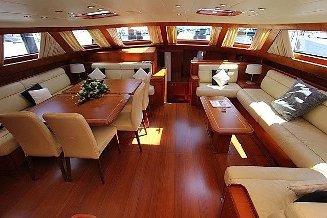 a room with a couch and a table aboard THIRTY NINE Yacht for Sale