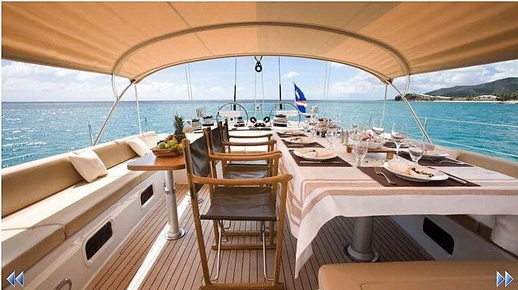 a table with plates and glasses on it aboard THIRTY NINE Yacht for Sale