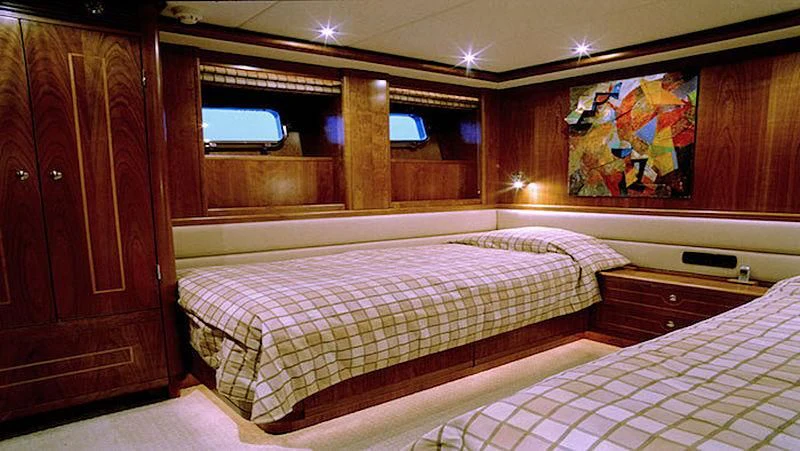 a room with two beds aboard MAVERICK Yacht for Sale