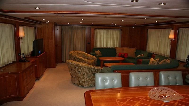 a living room with a couch and a table aboard MAVERICK Yacht for Sale