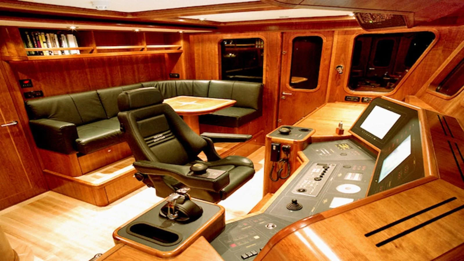 a living room with a couch and a coffee table aboard MAVERICK Yacht for Sale
