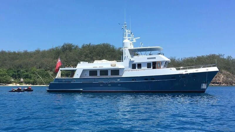 a large boat in the water aboard MAVERICK Yacht for Sale